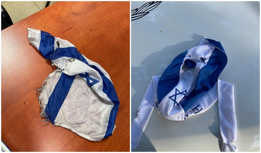 דגלי ישראל שהוצתו בחיפה (צילום: דוברות המשטרה)